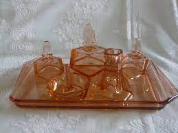 Maybe you would like to learn more about one of these? Art Deco Pink Glass Dressing Table Set