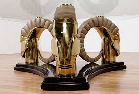 The heads are patinated brass. Neo Deco Brass And Black Lacquer Rams Head Table Modernism