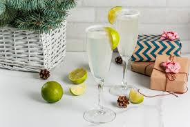 Christmas trees and santa hats: Premium Photo Ideas For Christmas And New Year Drinks Champagne Margarita Cocktails Garnished With Lime And Salt
