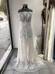 And ivory wedding dresses—well, ivory looks fabulous on just about everybody, especially lighter skin tones, as the warm hue contrasts with cool. Off White Light Ivory Bridal Lace Fabric Embroidered Beaded Pearls Sequins Floral Baroque Design Wedding Dress Scallop Edge Bodikian Textiles