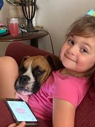 Layla loves her big sisters bed !