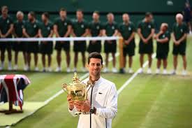 Novak serbia's novak djokovic celebrates defeating spain's roberto bautista agut during a men's. Djokovic Tops Federer In Historic Final For 5th At Wimbledon Bloomberg