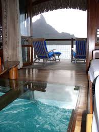 Inside An Over The Water Glass Floored Bungalow In Bora Bora Water Bungalow Overwater Bungalows Places
