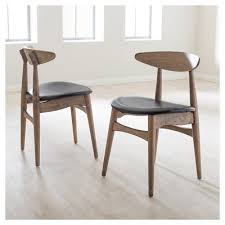 Edna Mid Century Modern French Black Faux Leather Oak Light Brown Finishing Wood Dining Chairs Set Of 2 Baxton Studio Solid Wood Dining Chairs Dining Chairs Dining Chair Set