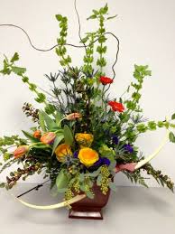 Bells Of Ireland Orange Gerbs Yellow Roses Orange Tulips Blue Thistle Curly Willow Funeral Floral Arrangements Funeral Floral Flower Centerpieces Wedding