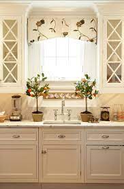 White Kitchen Cabinets Kitchen With Off White Cabinets White Kitchen Ideas White Kitchen Elegant Kitchens Kitchen Window Valances Kitchen Window Treatments