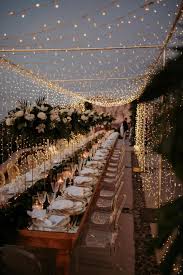 A Magical Wedding In Santorini Under A Canopy Of Fairy Lights Ruffled Lights Wedding Decor Wedding Lights Wedding Decorations