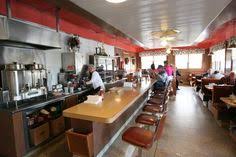 Having a small, round dining table can also help break up the space and create a naturally fluid feel. 55 Diner Cafe Design Ideas Cafe Design Diner Cafe