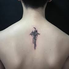 This tattoo looks like it has been painted by an adding some words definitely makes your intention of the tattoo more clear. 127 Of The Best Cross Tattoos That You Could Get In 2018