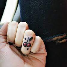 15 Delicate Finger Tats That Will Make You Want To Get Inked Asap Tiny Finger Tattoos Cherry Tattoos Hand Tattoos