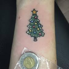 Then this is the perfect christmas tree. 45 Christmas Tattoos To Make Your Holiday More Memorable Blurmark Christmas Tattoo Tree Tattoo Tree Tattoo Designs