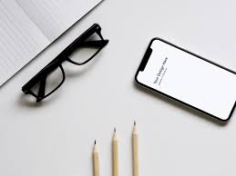 A Photo Based Mockup Showing An Iphone X Next To Glasses Paper And Pencils The Psd File Comes With A Smart Iphone Mockup Free Mockup Desk Iphone Mockup Psd