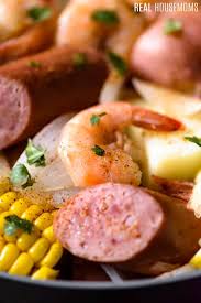 Tender lobster, shrimp, crab, tons of veggies and a delicious creole garlic seasoning, you'll make the whole party happy with this easy recipe! Shrimp Boil Real Housemoms