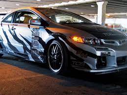Honda civic modified with after market headlights after market body kit. 2006 Honda Civic Si New Dog Likes Old Tricks Wrenchin