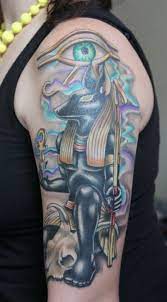 There's a feather surrounded by bright light in the foreground, too. 30 Egyptian Anubis Sleeve Tattoos