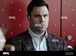 Massachusetts Athletic Director Ryan Bamford listens to a question from the  media before an NCAA college football game between the two schools,  Saturday, Oct. 26,, 2019, in Amherst, Mass. (AP Photo/Jessica Hill