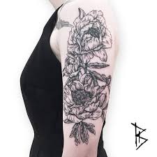 Want to discover art related to peonytattoo? Engraving Style Peony Tattoos On The Left Upper Arm