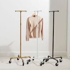 Instead of throwing your jacket on the back of a chair or piling your clothes on top of your bed, a garment rack will organize your closet and help keep your living space tidy. Monroe Trades Mobile Clothing Rack