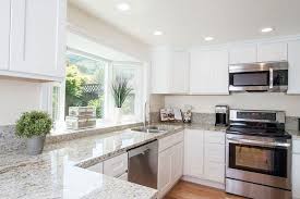 White kitchen with lg stainless. Colonial White Granite Countertops Pictures Cost Pros And Cons