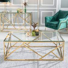 Whether you're looking for someplace soft to rest your feet or for a formal finishing touch, the right living room coffee table can pull your entire room together. Moneen Glass And Stainless Steel Gold Coffee Table Coffee Table Decor Living Room Table Decor Living Room Glass Table Living Room
