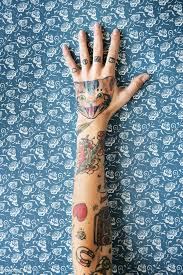 Download Premium Image Of Tattooed Hand On Blue Background 86251 Hand Tattoos Hand Tattoos For Women Free Tattoo