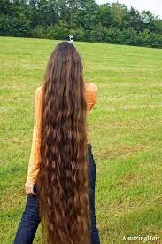 Woman combing beautiful long hair with wooden brush. Marianne Geupload Naar Pinterest Long Hair Styles Hair Beautiful Long Hair