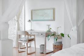 Saudade, small black cocktail table near blue velvet chairs: How Do You Choose An Interior Designer Toronto Realty Blog