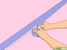 1 cut through the caulk by running the edge of the pry bar. How To Paint A Chair Rail With Pictures Wikihow