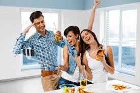 Catch my party features a super style mystery dinner, complete with a classic british dinner of prime rib and mashedpotatoes. Dinner Party At Home Friends Having Fun Taking Self Portrait Photo Using Smartphone Selfie Stick Eating Pizza Drinking Beer Indoors Holiday Celebration Friendship Leisure Technology Concept Stock Photo Picture And Royalty Free Image