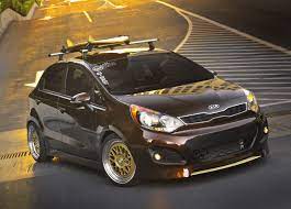 Antenna Enhanced The Stylish Rio 5 Door S Exterior With A Sunset Metallic Golden Brown Paint Custom Body Kit With A Front Sp Kia Rio Kia Rio Sedan Kia Picanto