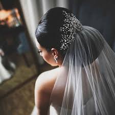 For the traditional bridal feeling add a veil at the back. Black Bride Bridal Hair Inspiration Low Bun Elegant Classic Hairstyle Chignon With Veil A Low Bun Wedding Hair Short Wedding Hair Black Brides Hairstyles