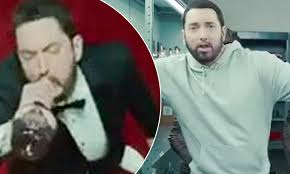Godzilla is a song by american rapper eminem featuring american rapper juice wrld. Eminem Swigs Alcohol Before Storming A Market With Dinosaurs In Trailer For New Godzilla Music Video Daily Mail Online