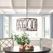 This 4 light drum cage chandelier features in natural wooden frames and black oval cage lines. Cage Chandelier Birch Lane