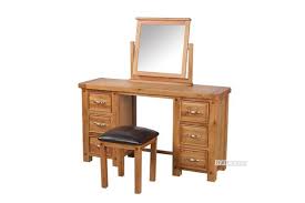 It has a table where you place your hygiene and skincare essentials, a drawer to store your important items, and an accessible mirror. Westminster 6drw Dressing Table With Stool Solid Oak
