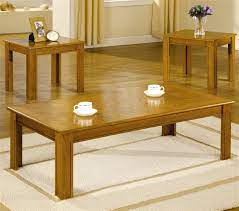 This is a nice coffee table set in excellent condition. 3 Piece Occasional Table Set In Golden Oak Finish By Coaster 5168