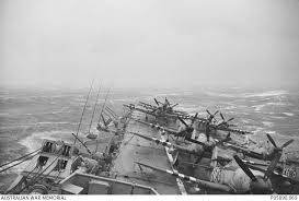 The carrier was sold to australia in 1947. Hmas Sydney Iii With Sea Fury And Firefly Aircraft Lashed To The Deck Rides Out Typhoon Ruth Australian War Memorial