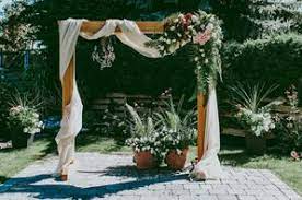 Diy a wedding arch with cherry branch and silk flowers. Diy Wedding Arches