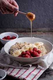Creamy Oatmeal Bowls With Raspberries Seeds And Honey Simply Delicious Recipe Healthy Oatmeal Breakfast Breakfast Bowls Food