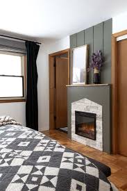 4.0 out of 5 stars. Bedroom With Electric Fireplace With Green And Airstone Fireplace Surround Bright Green Door