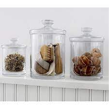 Simple bathroom storage with a retro feel. Glass Canisters Crate And Barrel Glass Canisters Glass Shelves Decor Glass Canister Set