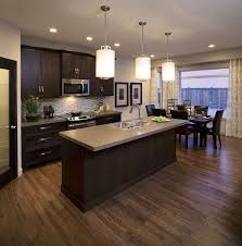 Orleans 2 Cardel Homes Brown Kitchen Cabinets Dark Brown Kitchen Cabinets Kitchen Flooring