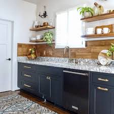 Next up in kitchens before and after kitchen: Cambria We Re Swooning Over Lex Alana Listed Sisters S Fresh Kitchen Details Marbled Black And White Rosedale Countertops A Wood Plank Backsplash And Matte Black Cabinetry Http Bit Ly 2bqttvb Facebook
