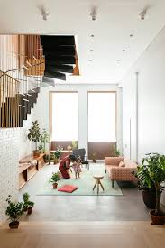 A Hole In The Upper Floor Makes Way For The New Staircase Which Connects A Living Area Minimalist Dining Room Minimalist Home Decor Small Living Room Design