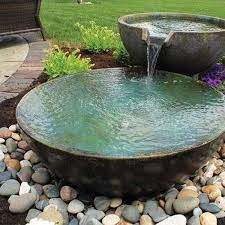 The one at the bottom is the largest. Decoration Through Pebbles Diy Stone Decor Ideas For Water Features Water Features In The Garden Backyard Water Feature Landscaping Water Feature