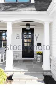 Great selection of floor & wall tile at allmodern®. Front Porch Of Custom Home With White Bench And Flowerspots In Sunlight Korbach Hesse Germany Europe Stock Photo Alamy
