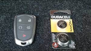 The front features five buttons, including door lock, door unlock, remote start, trunk release, and panic (horn/lights) activation. Cadillac Key Fob Battery Replacement 2014 2018 Keyless Remote Ats Youtube