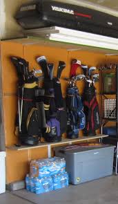 My Golf Club Storage Inexpensive Solution To Using The Vertical Space In The Garage Using Bungee Cords Attached To Th Golf Clubs Golf Carts Golf Club Grips