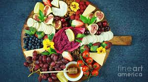 A grazing platter is a lot like a cheese board or charcuterie board. Cheese And Fruit Charcuterie Dessert Grazing Platter On Wooden Board Photograph By Milleflore Images
