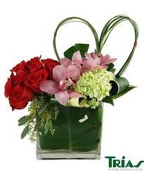 Looking For Love An Arrangement Of Red Roses Green Hydrangeas Pink Cymbidium Orchids Variegated Aspidistra Leave Flower Delivery Flowers Flower Arrangements