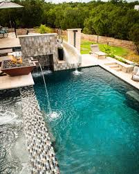 The slides beside the pool provide entertainment to the kids when it comes to an indoor bath. Beautiful Rectangular Pool With Slide Rectangular Pool Pools Backyard Inground Luxury Pools